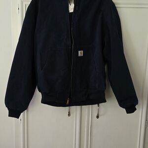 Nice dark, dark blue used Carhartt jacket with hood.